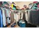 Walk-in closet with racks of clothing, providing ample storage space at 692 Oakside Pl, Acworth, GA 30102