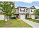 Charming townhome with a stone facade, red shutters, and a well-manicured lawn at 692 Oakside Pl, Acworth, GA 30102