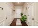 Bright foyer featuring hardwood floors, decorative trim, and a view of the front door at 692 Oakside Pl, Acworth, GA 30102