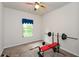 Bright home gym featuring weightlifting equipment and a window with natural light at 692 Oakside Pl, Acworth, GA 30102