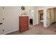 Hallway featuring a dresser on the left and doorways leading to other rooms at 692 Oakside Pl, Acworth, GA 30102