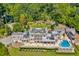 Aerial view of the estate showcasing the layout, pool, manicured grounds, and surrounding greenery at 1040 W Conway Nw Dr, Atlanta, GA 30327