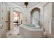 Luxurious primary bathroom boasts soaking tub, dual sinks, and adjacent dressing area at 1040 W Conway Nw Dr, Atlanta, GA 30327