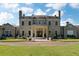 Elegant home with brick facade, symmetrical design, grand columns, and manicured landscaping offering timeless curb appeal at 1040 W Conway Nw Dr, Atlanta, GA 30327