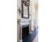 Close-up of a ornate fireplace with detailed carvings and a decorative mirror above at 1040 W Conway Nw Dr, Atlanta, GA 30327