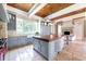 Open-concept kitchen with a large island, custom cabinets, and a cozy fireplace at 1040 W Conway Nw Dr, Atlanta, GA 30327