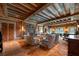 Expansive living room features a fireplace, wooden beams, and comfortable seating at 1040 W Conway Nw Dr, Atlanta, GA 30327