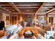 Elegant living room showcases exposed beams, fireplace, and classic furniture at 1040 W Conway Nw Dr, Atlanta, GA 30327