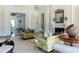 Elegant living room with plush sofas, fireplace, and view into an adjoining room at 1040 W Conway Nw Dr, Atlanta, GA 30327