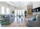 Living room with light blue accents, chandelier, and an abundance of natural light at 1040 W Conway Nw Dr, Atlanta, GA 30327