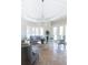 Bright living room with high, domed ceiling, chandelier, and neutral color palette at 1040 W Conway Nw Dr, Atlanta, GA 30327