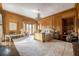 Spacious main bedroom with wood paneling, chandelier, desk area, and cozy seating at 1040 W Conway Nw Dr, Atlanta, GA 30327