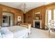 Elegant main bedroom featuring wood paneling, fireplace, and en suite bathroom at 1040 W Conway Nw Dr, Atlanta, GA 30327
