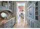 Elegant butler's pantry with custom cabinets and decor, open to dining area at 1040 W Conway Nw Dr, Atlanta, GA 30327