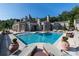 Stunning backyard featuring a large in-ground pool with sun loungers and an expansive patio area for entertaining at 1040 W Conway Nw Dr, Atlanta, GA 30327