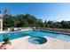Large in-ground pool and spa with comfortable patio seating at 1040 W Conway Nw Dr, Atlanta, GA 30327