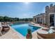 Luxury pool and patio with lush greenery and ample lounge chairs at 1040 W Conway Nw Dr, Atlanta, GA 30327