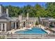 Aerial view of the backyard with large pool, spa, and patio at 1040 W Conway Nw Dr, Atlanta, GA 30327