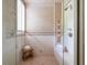 Modern shower with glass enclosure, bench, and tiled walls at 1040 W Conway Nw Dr, Atlanta, GA 30327