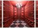 Spacious wine cellar with custom shelving and elegant chandelier at 1040 W Conway Nw Dr, Atlanta, GA 30327