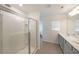 Bathroom featuring glass enclosed shower, double sinks, and modern lighting at 1312 Cooper Springs Rd, Grayson, GA 30017