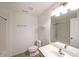 Well-lit full bathroom with a sink, toilet, mirror, and a bathtub-shower combo at 1312 Cooper Springs Rd, Grayson, GA 30017