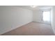 Neutral bedroom featuring carpet, bright windows, and ample space at 1312 Cooper Springs Rd, Grayson, GA 30017