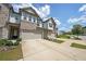 Inviting townhome boasting brick accents, a spacious two-car garage, and a neatly landscaped yard at 1312 Cooper Springs Rd, Grayson, GA 30017
