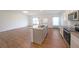 Stylish kitchen featuring a large island with a sink and stainless-steel appliances at 1312 Cooper Springs Rd, Grayson, GA 30017