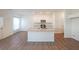 A modern kitchen with an island, granite countertops, and stainless steel appliances at 1312 Cooper Springs Rd, Grayson, GA 30017