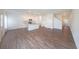 Bright, open-concept living area featuring hardwood floors and a modern kitchen with island at 1312 Cooper Springs Rd, Grayson, GA 30017
