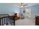 Cozy bedroom with a crib, rocking chair, and natural light creating a relaxing atmosphere at 3517 Greenway Dr, Marietta, GA 30008