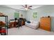 Bright bedroom with dual windows, desk, work space and comfortable seating, ideal for a home office at 3517 Greenway Dr, Marietta, GA 30008