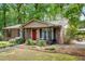 Charming brick home with a well-manicured front yard and a welcoming entrance at 3517 Greenway Dr, Marietta, GA 30008