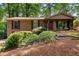 Charming brick home featuring lush landscaping and inviting front entrance at 3517 Greenway Dr, Marietta, GA 30008