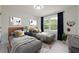 Cozy bedroom featuring two twin beds, neutral decor, and a window letting in natural light at 4085 Chadds Walk, Marietta, GA 30062