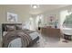 Inviting bedroom with a comfortable bed, a soft color palette, and plenty of natural light at 4085 Chadds Walk, Marietta, GA 30062