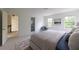 Bright bedroom featuring a cushioned headboard, and large windows providing lots of natural light and an ensuite bathroom at 4085 Chadds Walk, Marietta, GA 30062