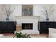Close-up of a white fireplace with decorative accents and a brick hearth at 4085 Chadds Walk, Marietta, GA 30062