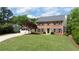 Charming two-story brick home featuring a well-manicured lawn and attached two car garage at 4085 Chadds Walk, Marietta, GA 30062