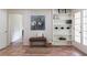 Hallway with a bench, bookshelf, terracotta flooring, and French doors at 4085 Chadds Walk, Marietta, GA 30062
