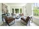Cozy sitting area with large windows, stylish furniture, and a patterned rug at 4085 Chadds Walk, Marietta, GA 30062
