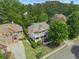 Aerial view of a beautifully landscaped property with a well-maintained lawn and charming curb appeal at 4731 Moon Chase Dr, Buford, GA 30519
