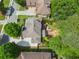 Aerial view of home showcasing backyard with patio, koi pond, fire pit, and mature landscaping at 4731 Moon Chase Dr, Buford, GA 30519