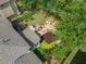 A stunning backyard with a patio, fire pit, lush landscaping, and a charming outdoor seating area for relaxation and entertaining at 4731 Moon Chase Dr, Buford, GA 30519