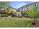 Backyard with koi pond, multiple seating areas, well manicured lawn, and tiered deck at 4731 Moon Chase Dr, Buford, GA 30519
