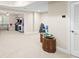 Large finished basement with multiple arcade games, seating and bright overhead lighting at 4731 Moon Chase Dr, Buford, GA 30519