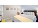 Bedroom with side tables, neutral walls, and view into adjacent room at 4731 Moon Chase Dr, Buford, GA 30519