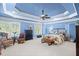 This primary bedroom boasts a tray ceiling, generous natural light, and ample space for relaxing at 4731 Moon Chase Dr, Buford, GA 30519