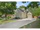 A two-car garage and driveway of a beautiful home with stone and siding exterior at 4731 Moon Chase Dr, Buford, GA 30519